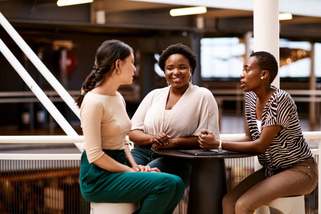 Shot of a group of businesswomen having a dicsussion in an office